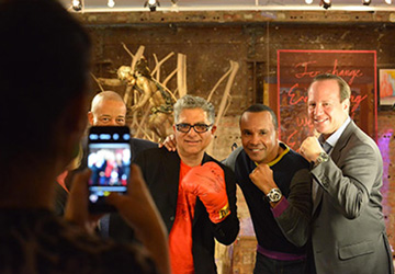 Sugar Ray & Deepak kicking a punch with our team on the ONE WORLD set at Deepak Homebase!
